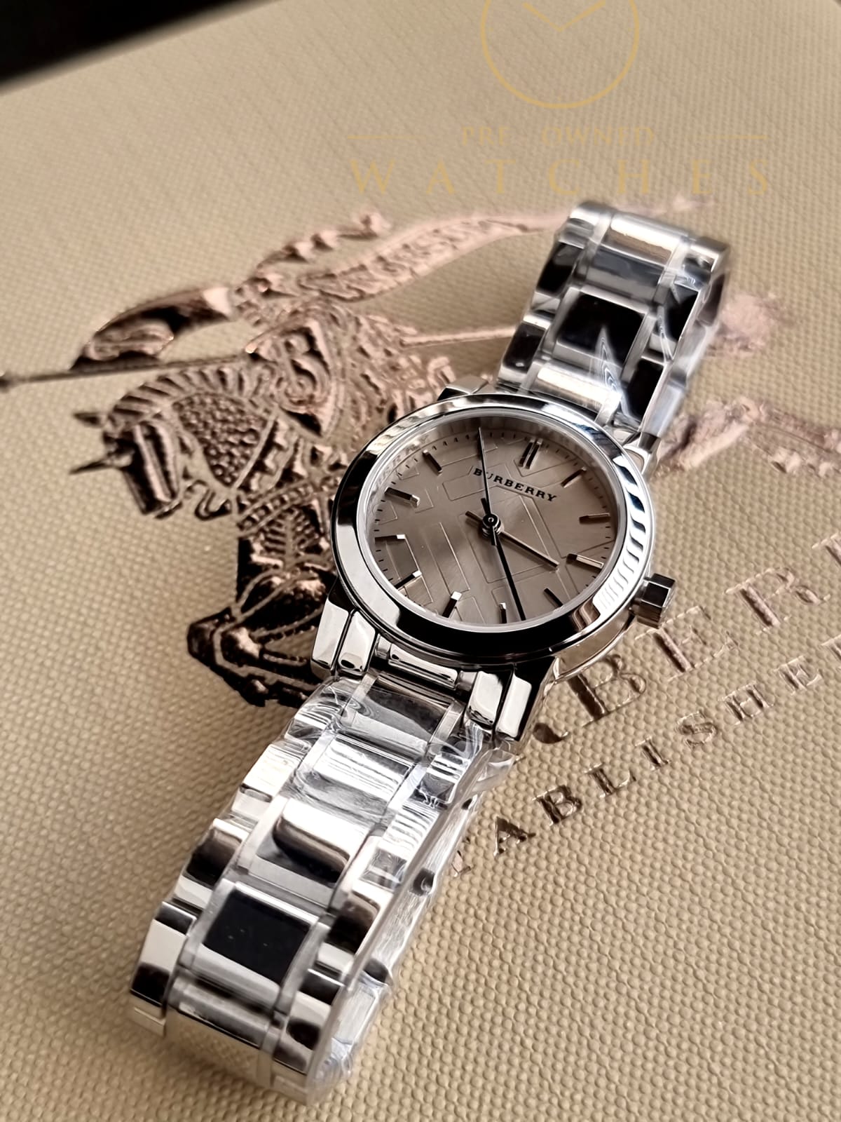Burberry Women’s Swiss Made Quartz Stainless Steel Grey Check Stamped Dial 26mm Watch BU9229