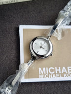 Michael Kors Izzy Silver Dial Silver Stainless Steel Bangle Quartz Watch 28mm for Ladies – MK4930