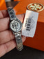 Tory Burch Reva Silver Stainless Steel Cream Dial Quartz Watch for Ladies - TBW4044