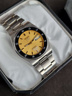 Seiko 5 Men's Automatic Day-Date Watch – 36mm Golden Dial & Stainless Steel Bracelet