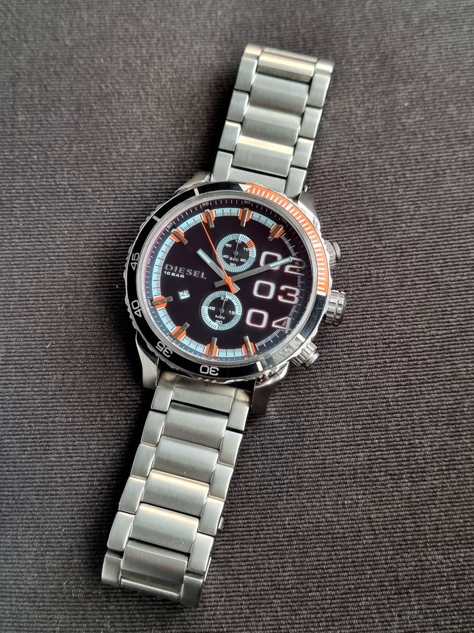 Diesel Men's Quartz Watch – Black Dial, Silver Stainless Steel Bracelet, Black & Orange Bezel, 50mm