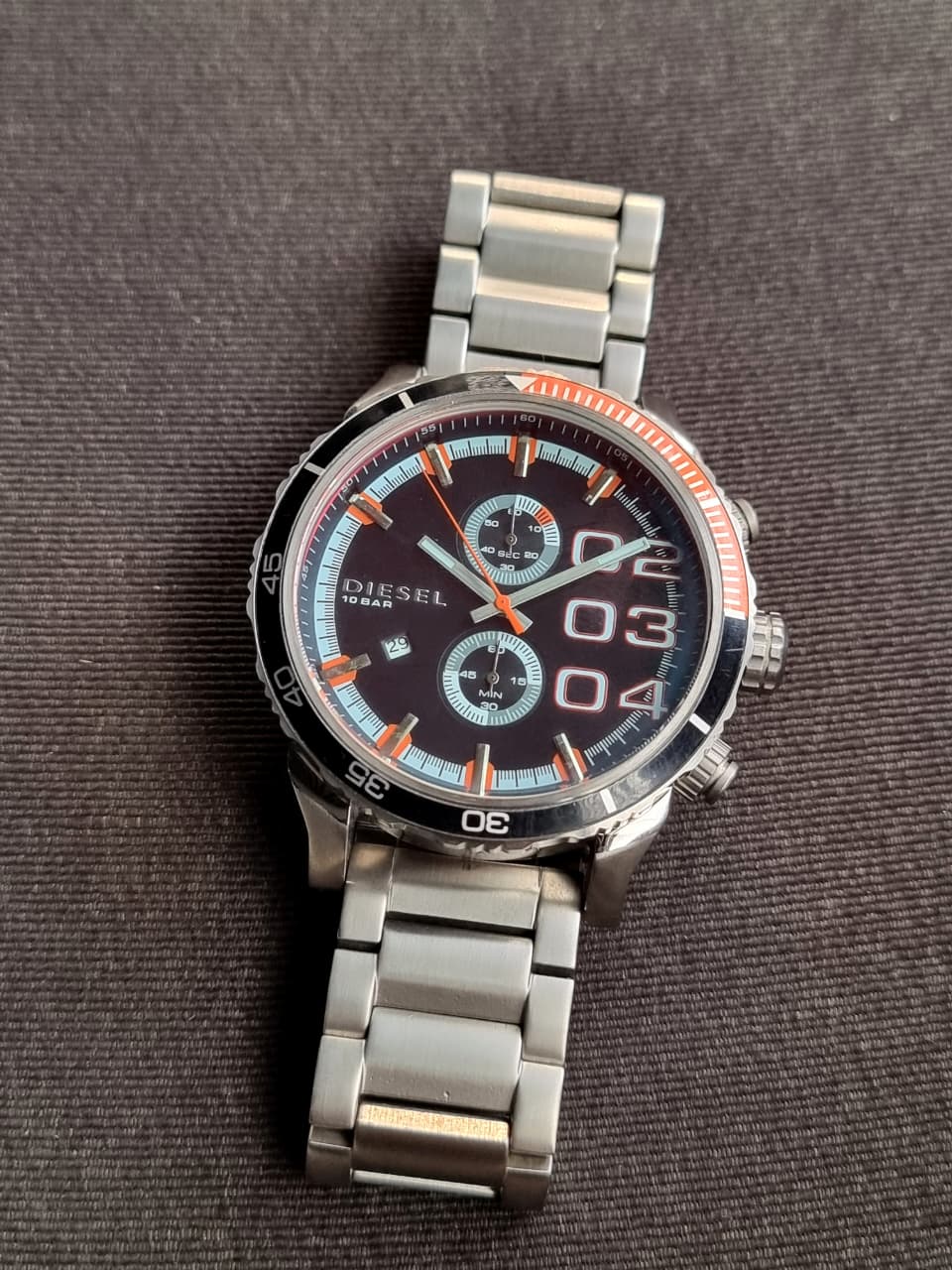 Diesel Men's Quartz Watch – Black Dial, Silver Stainless Steel Bracelet, Black & Orange Bezel, 50mm