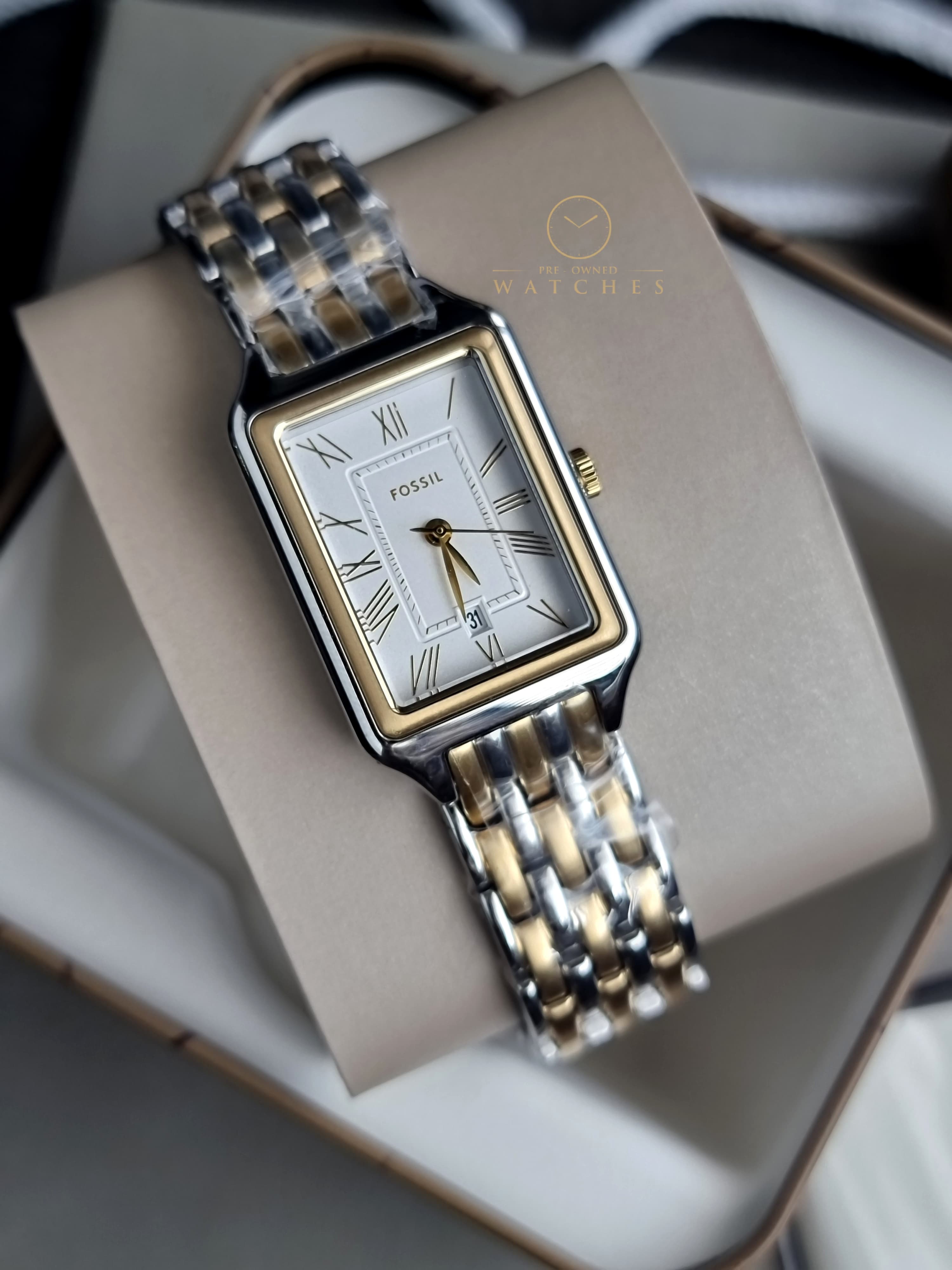 Fossil Women's Raquel Three-Hand Date Silver and Gold Two-Tone Stainless Steel Bracelet Watch (Model: ES5368)