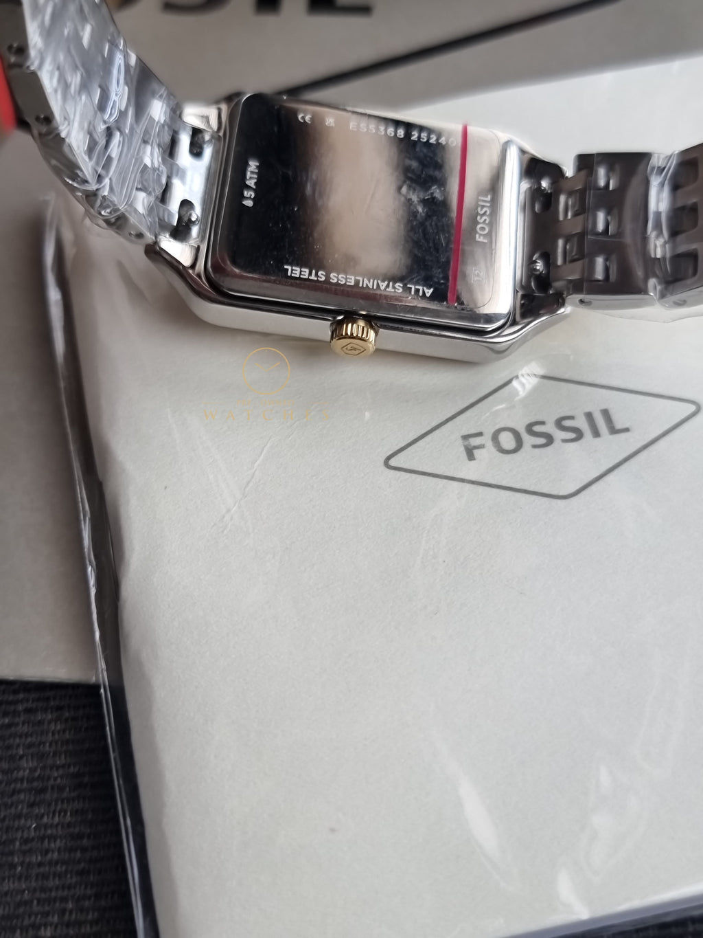 Fossil Women's Raquel Three-Hand Date Silver and Gold Two-Tone Stainless Steel Bracelet Watch (Model: ES5368)