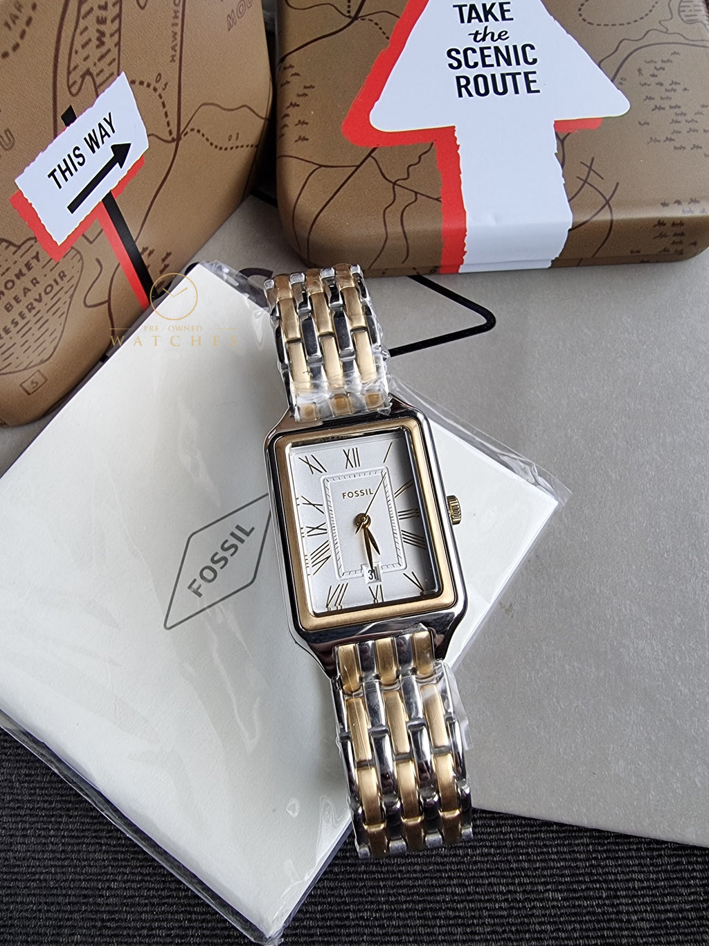 Fossil Women's Raquel Three-Hand Date Silver and Gold Two-Tone Stainless Steel Bracelet Watch (Model: ES5368)