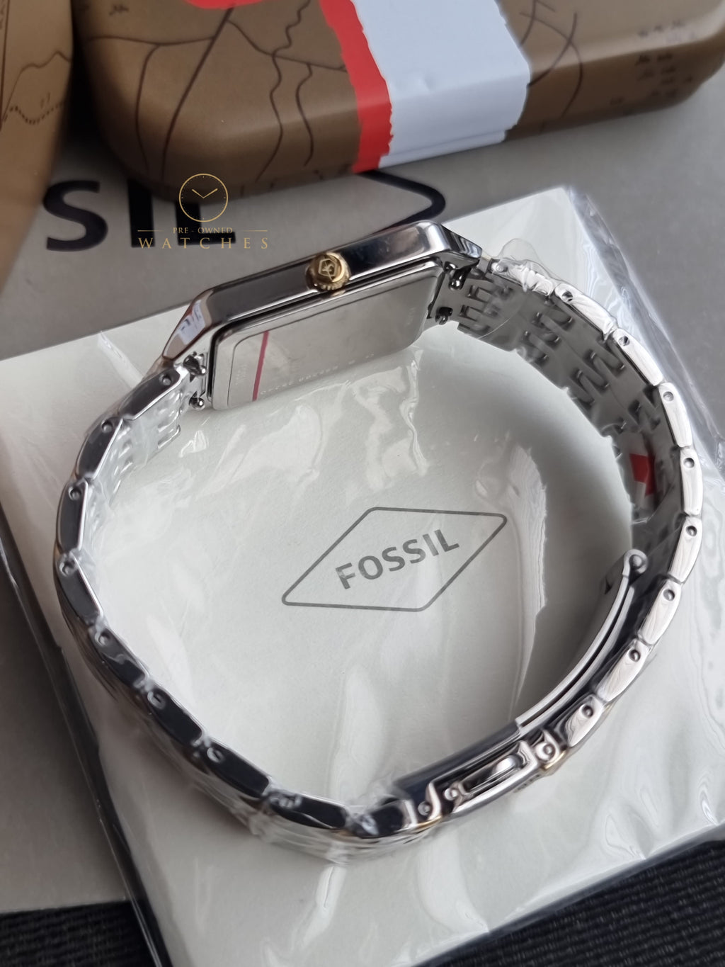 Fossil Women's Raquel Three-Hand Date Silver and Gold Two-Tone Stainless Steel Bracelet Watch (Model: ES5368)
